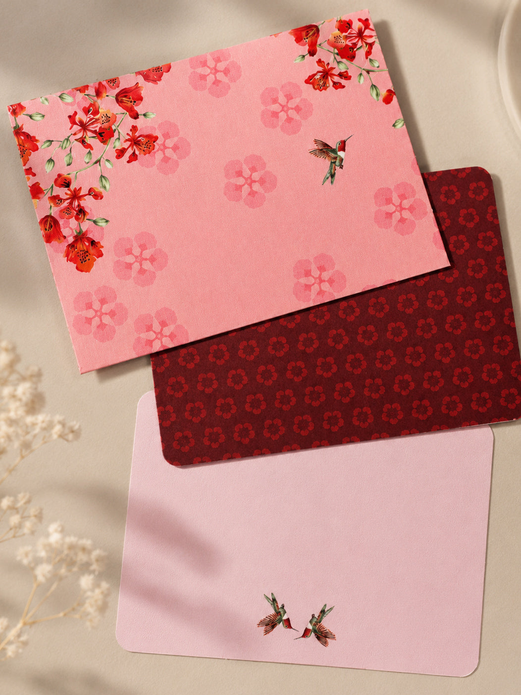 Blossom Notes thank-you card faces — pink floral, burgundy pattern, pale hummingbird pair