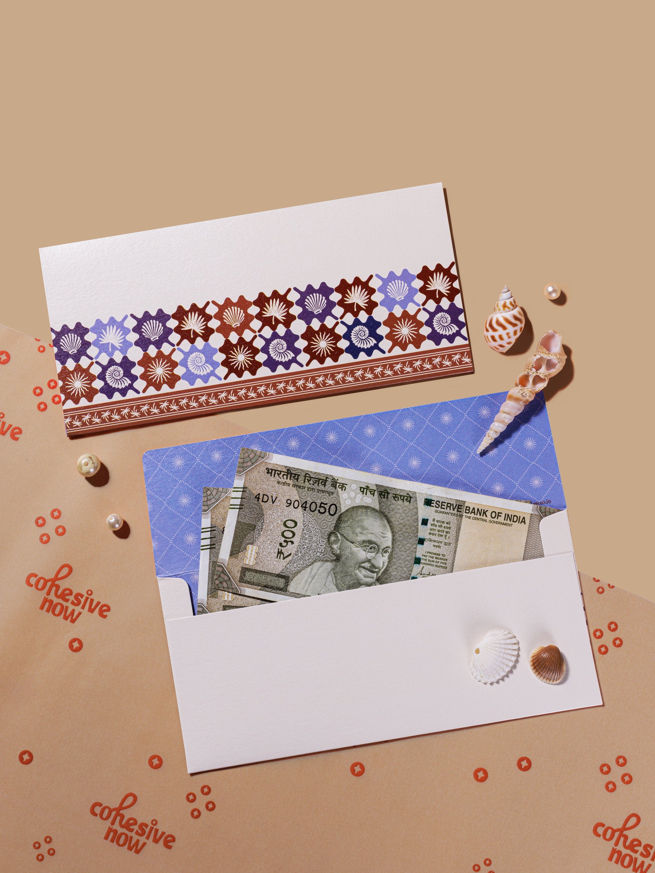 Coastal Escape money envelopes in blue and maroon shell motifs