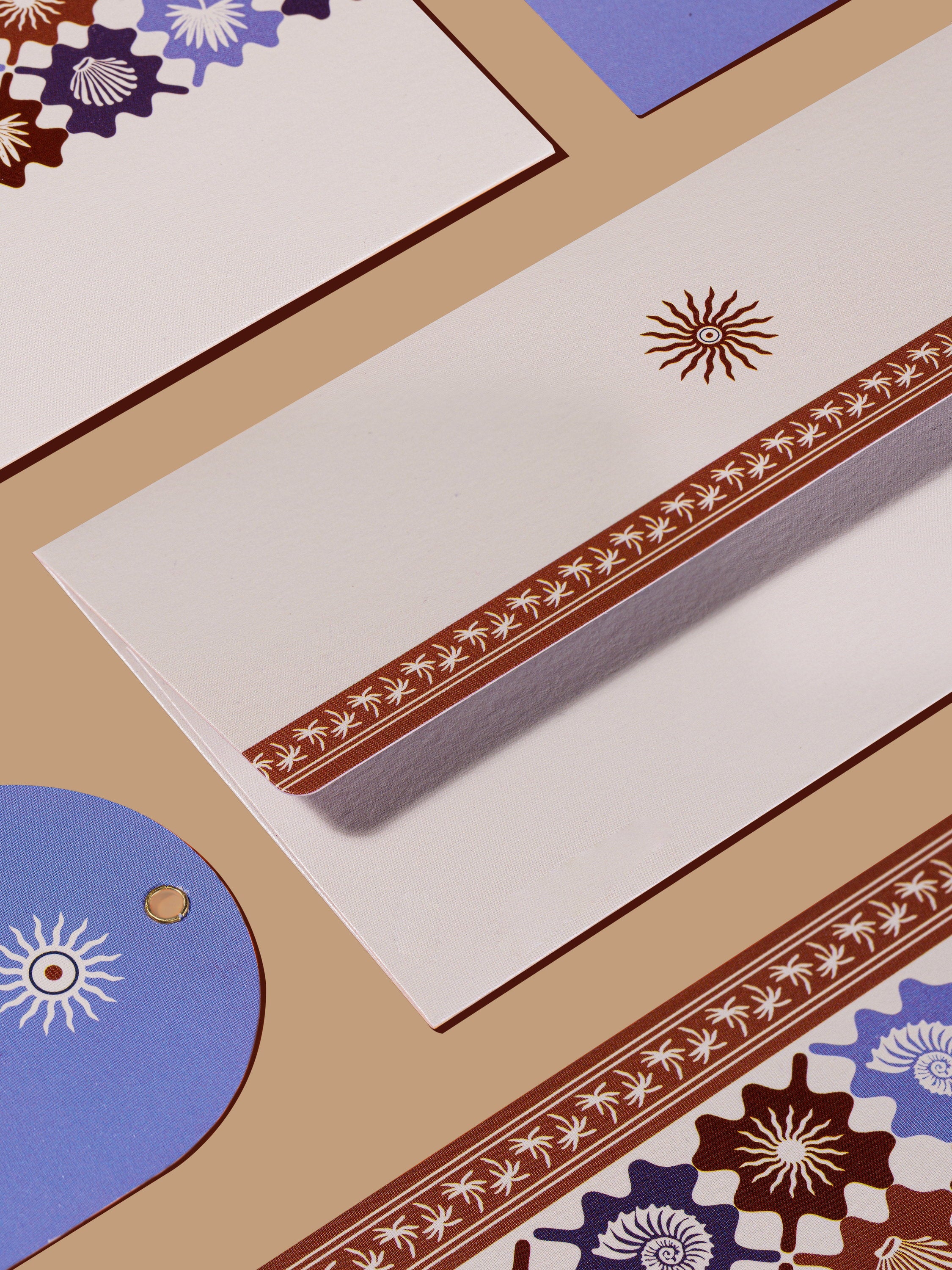Coastal Escape money envelopes in blue and maroon shell motifs