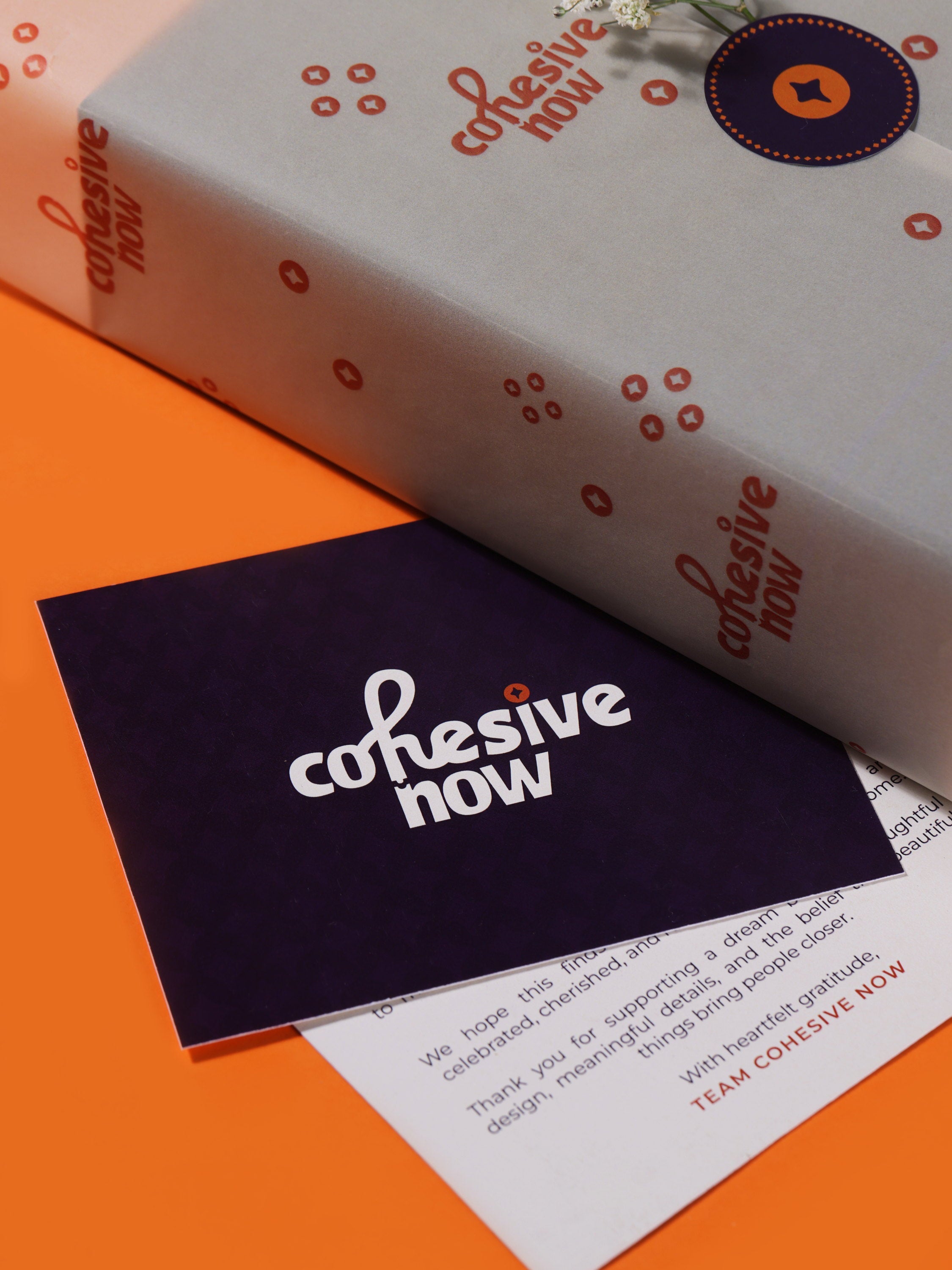 CohesiveNow tissue-wrapped packaging with a handwritten thank-you note