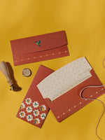 Mango Tales money envelopes in terracotta with white star florals