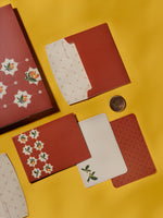 Mango Tales thank-you cards in terracotta with white star florals